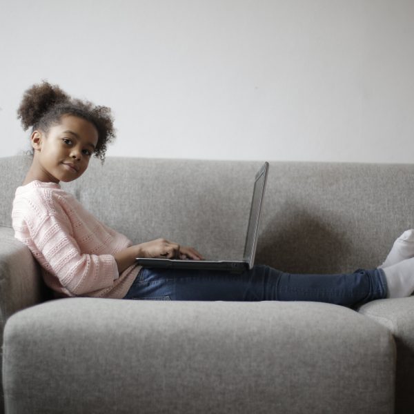 Photo of a young person using a laptop.