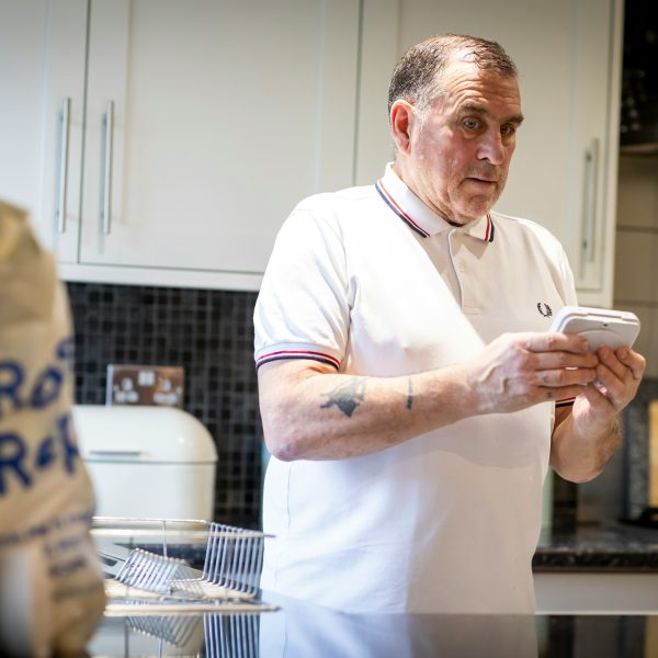 Photo of a man reading an energy meter.