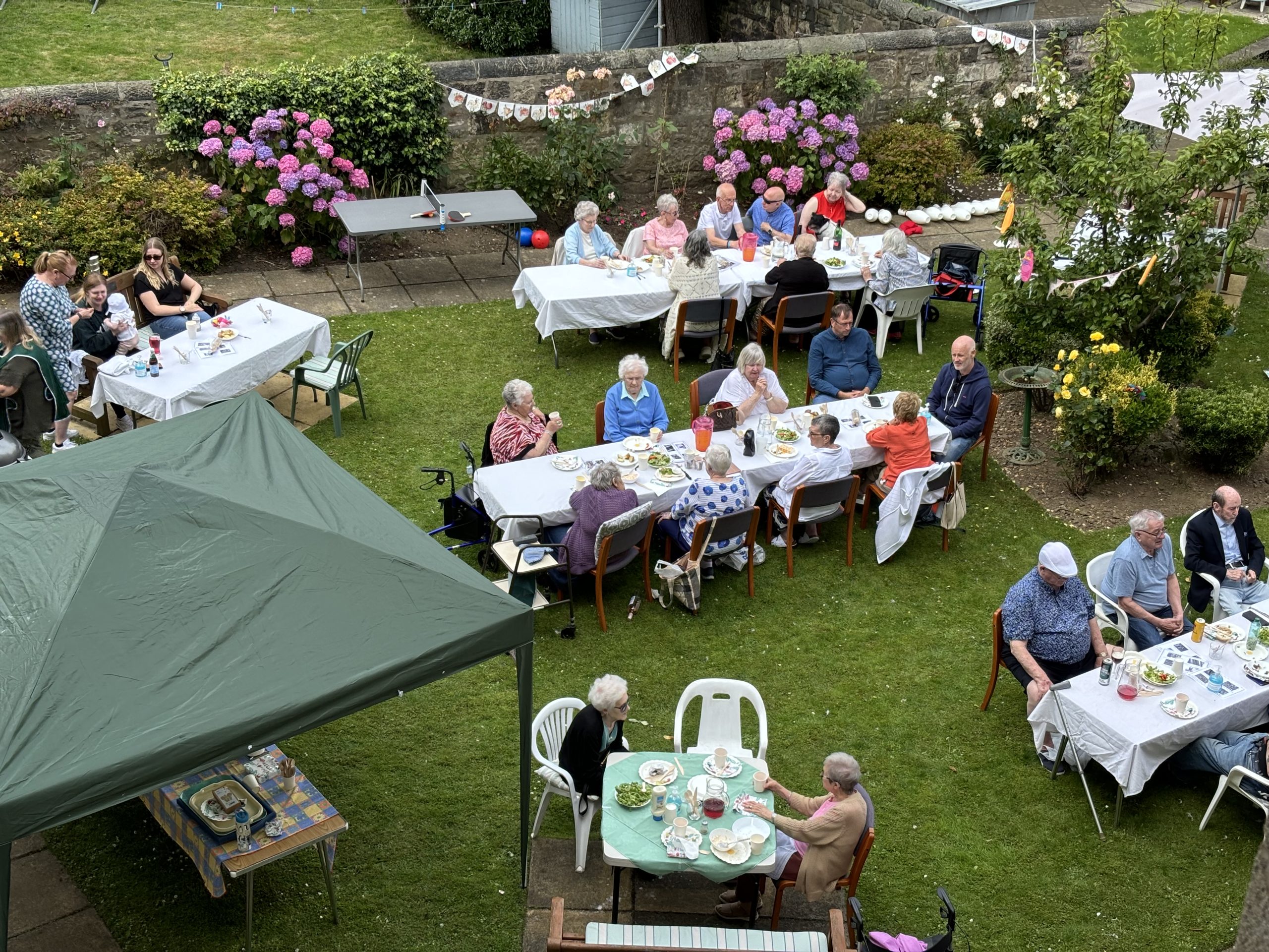 Photo of sheltered housing tenants enjoying a BBQ.