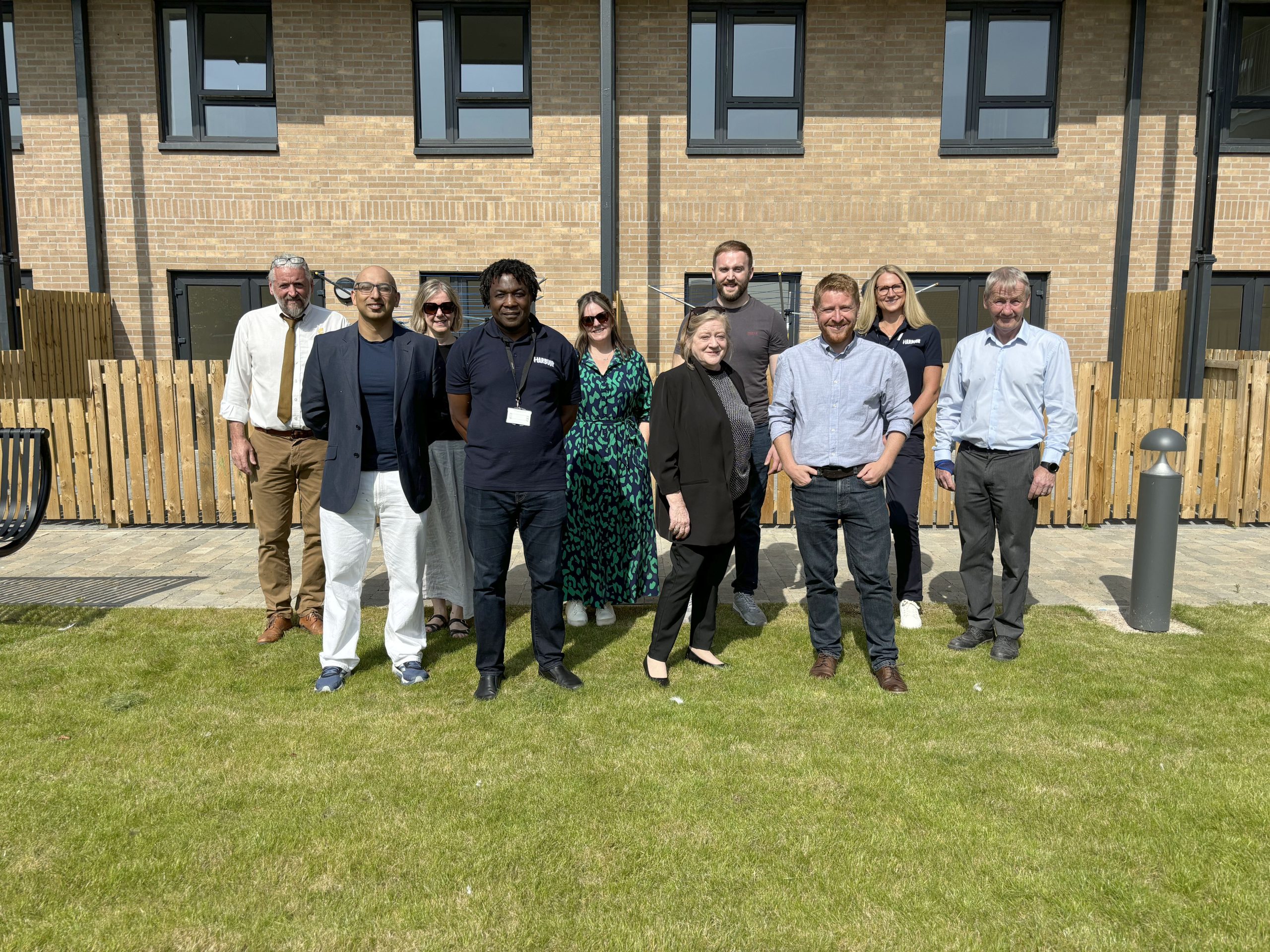 Photo of group gathering at official opening of the house.
