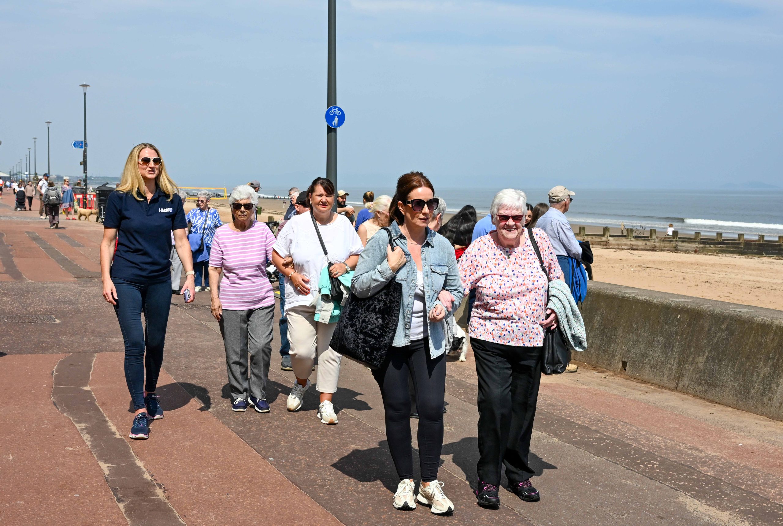 Photo of tenants walking at Portobello beach.