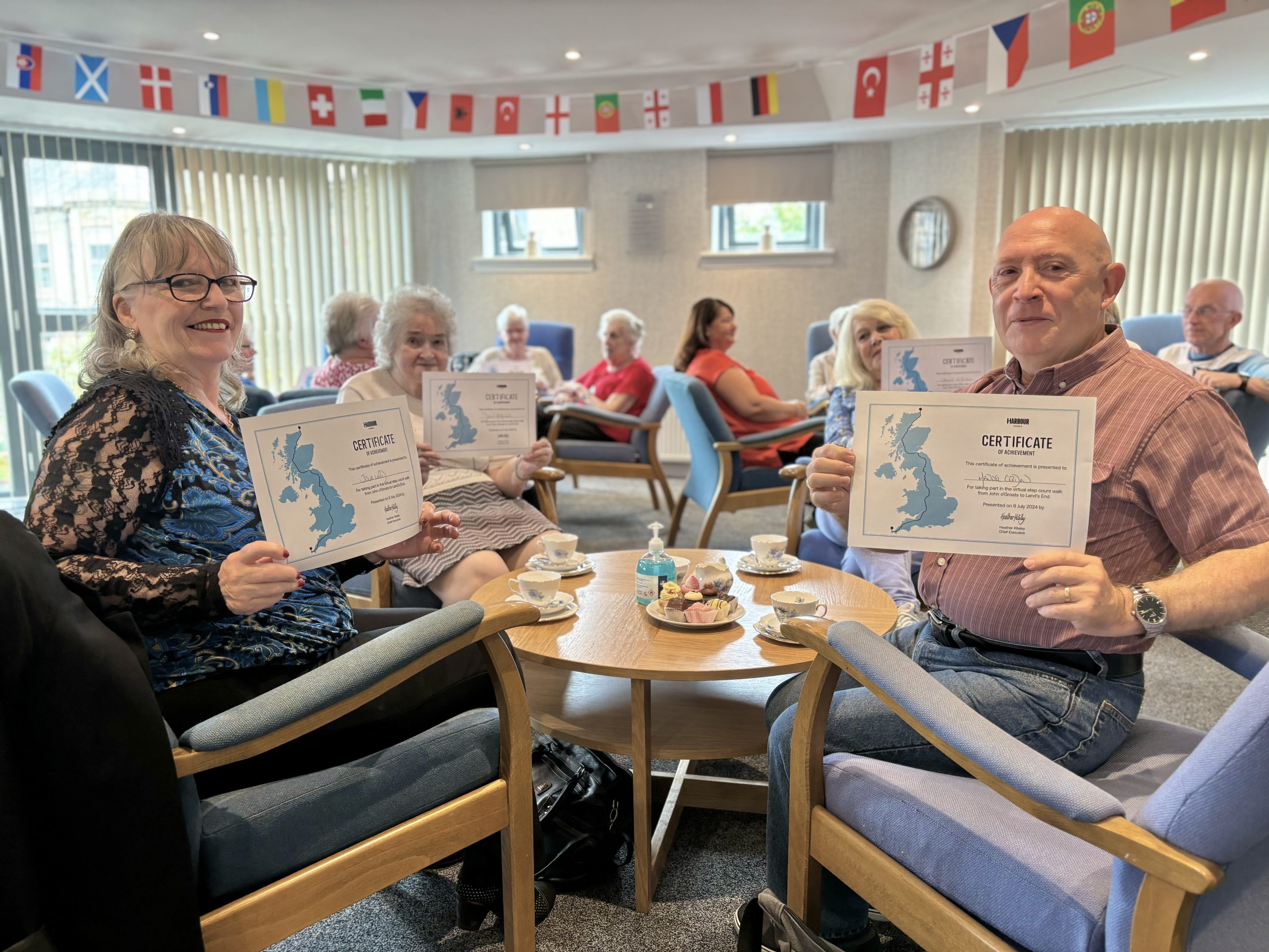 Photo of tenants holding up their walk certificates.