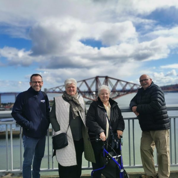 Photo of tenants on the Forth Road Bridge with the Forth Rail Bridge in the background.