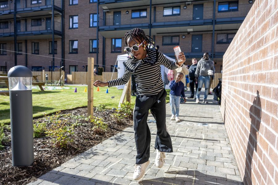 Photo of a girl playing hop scotch.