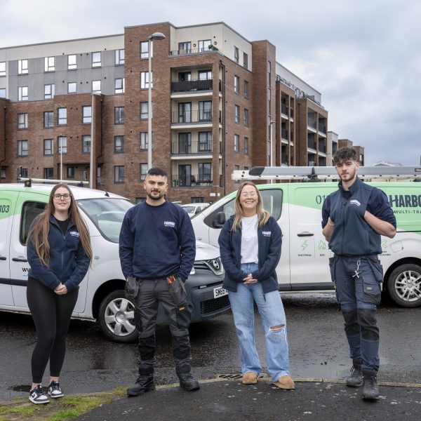 Photo of Harbour Mutli-Trades staff standing in front of their vans.