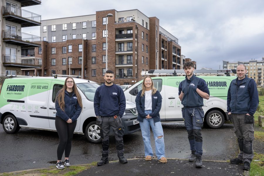 Photo of Harbour Mutli-Trades staff standing in front of their vans.