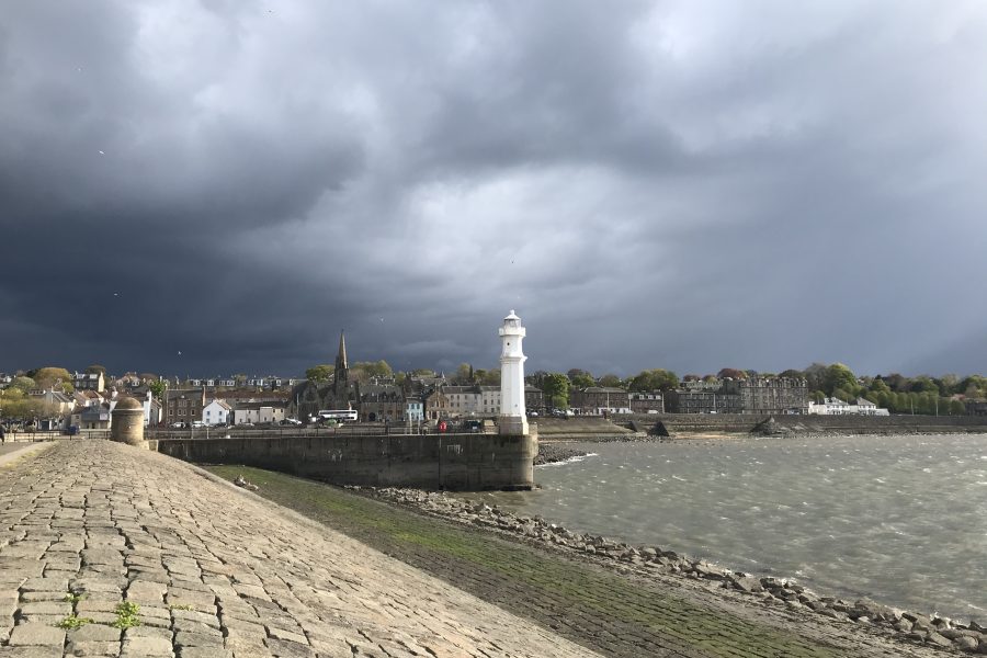 Photo of Newhaven harbour surrounded by dark clouds.