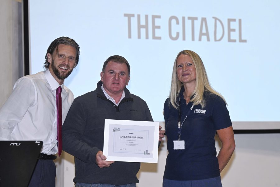 Phot of The Citadel collecting their award.