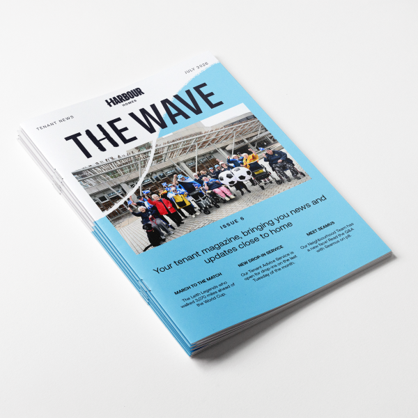 Photo of the tenant magazine with a cover image featuring the Leith Legends walking group.