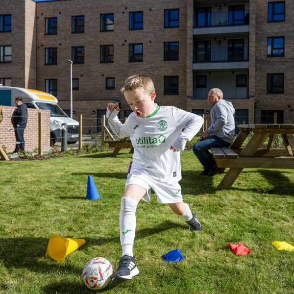 Photo of a young boy playing football.