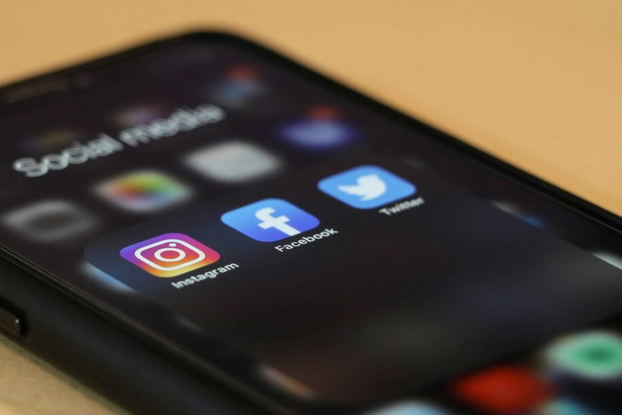 Photo of a phone screen showing social media app icons.