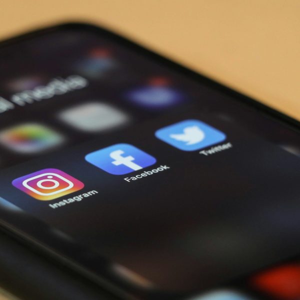Photo of a phone screen showing social media app icons.